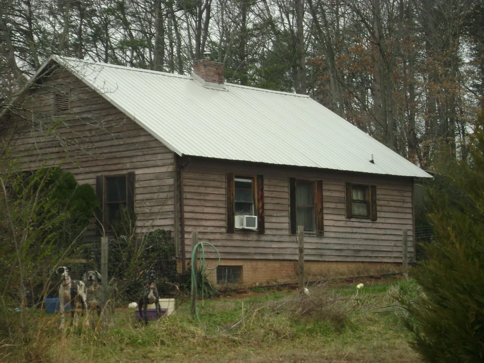 White metal roof on an old wood sided farmhouse, from a Metal Roof Installation job in Dublin